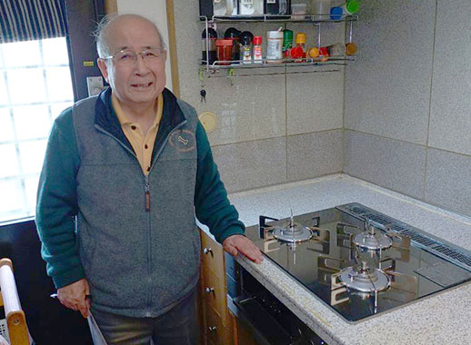 施工後のコンロとお客様